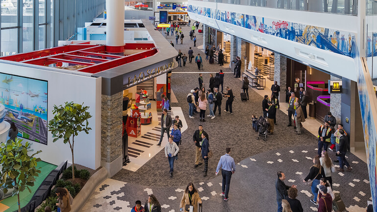 View of people walking through LaGuardia B Terminal's Eastern Concourse